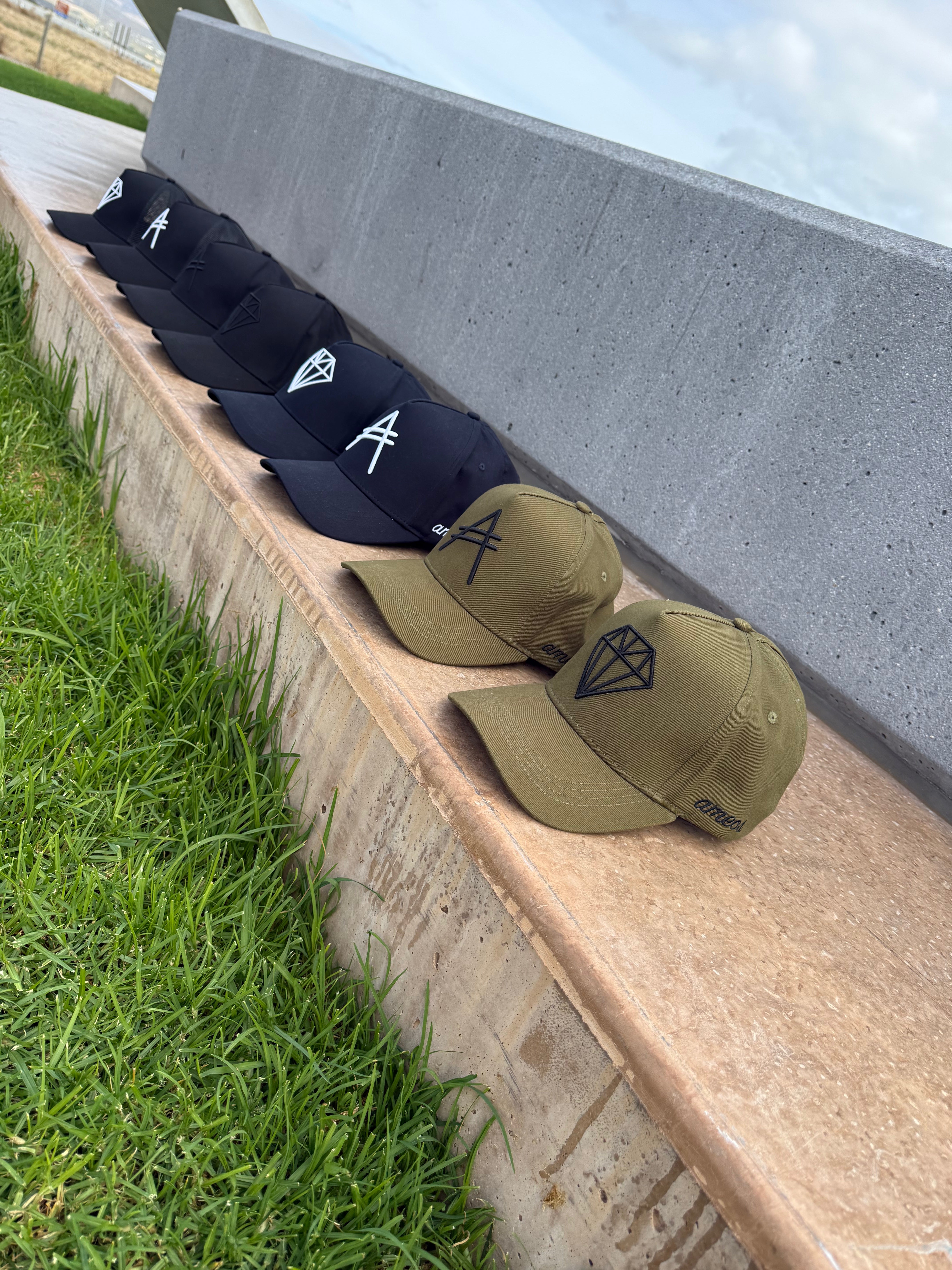 All A-Frame Hats lined up, showing that they are a limited drop and only 50 pieces per design available.